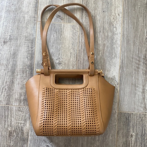 Handbags - Non brand tan purse with cute detail.  Shows wear inside pocket.